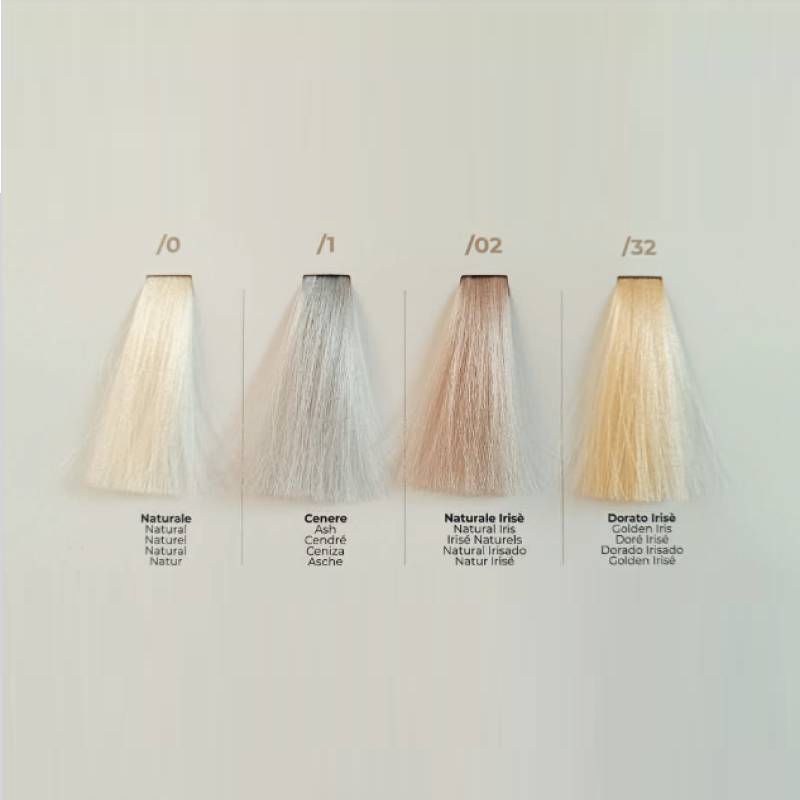 Four hair color swatches on a pale panel labeled /0, /1, /02, /32 with the names Natural, Cenere, Naturale Irisé, and Dorato Irisé.